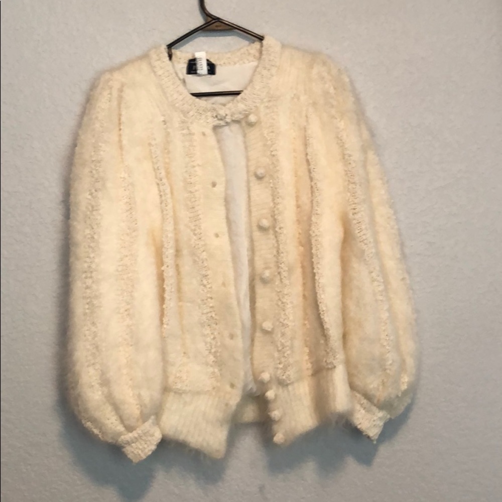 Fluffy cream colored sweater with buttons